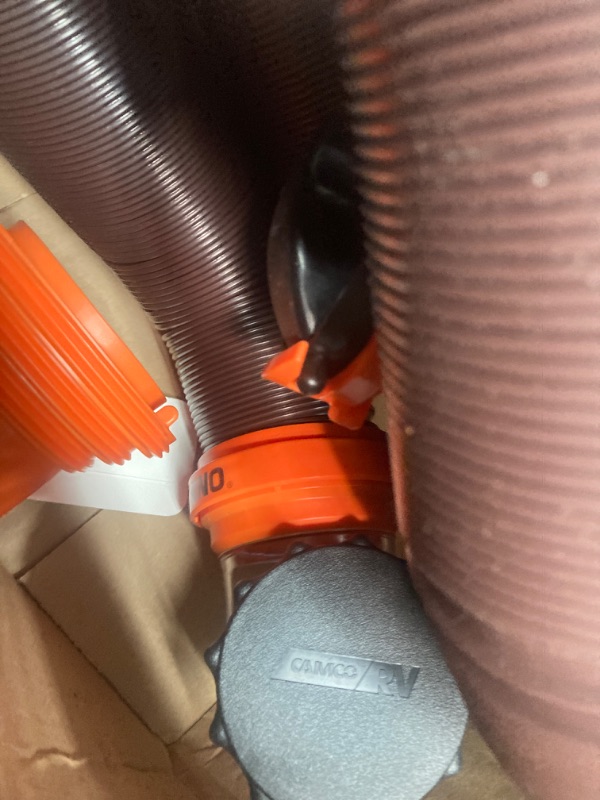 Photo 1 of Missing accessories •  Camco RhinoFLEX RV Sewer Hose Kit with Swivel Transparent Elbow and 4-in-1 Dump Station Fitting, Brown, 15 Feet (39770) 15ft Sewer Hose Kit Frustration-Free Packaging