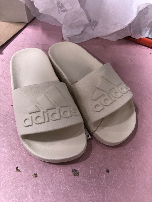 Photo 2 of Adidas Unisex Adilette Aqua Slide Sandal, Off White/Off White/Off White, 4 US Men
