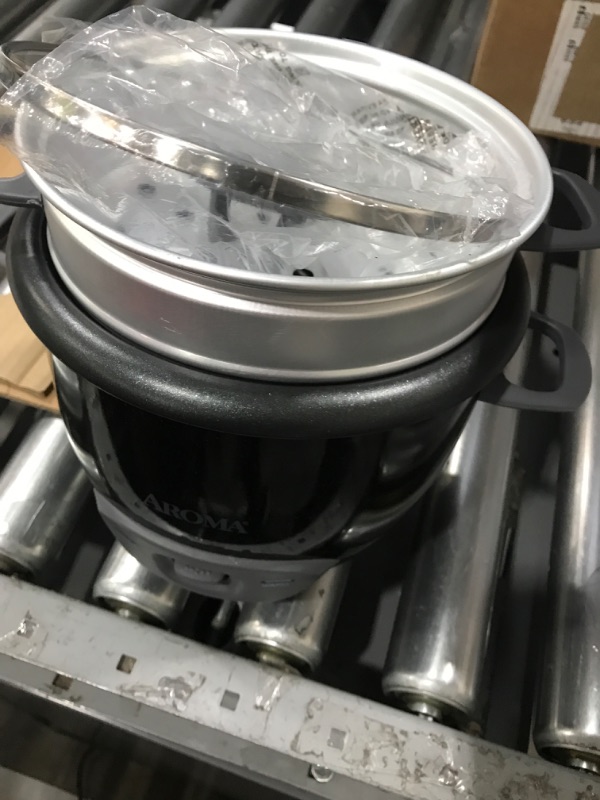 Photo 2 of ***USED - LIKELY MISSING PARTS - UNABLE TO VERIFY FUNCTIONALITY***
Aroma Housewares 6-Cup (Cooked) Pot-Style Rice Cooker and Food Steamer, Black ARC-743-1NGB