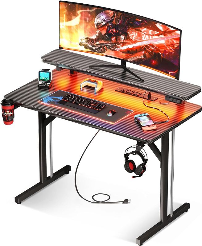 Photo 1 of MOTPK Small Gaming Desk with LED Lights & Power Outlets, 31 Inch Computer Desk Gaming Table with Monitor Shelf, Gamer Desk with Carbon Fiber Texture, Kids Boys Desk Gift for Men 31 Inch Black