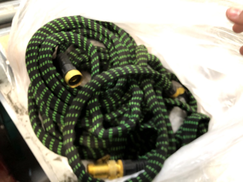 Photo 2 of Garden Hose 50ft, 10 Function Spray Nozzle Water Hose 50 feet with Extra Strength 3750D, Flexible Hose Durable 4-Layers Latex with Leakproof and 3/4" Solid Brass Fittings