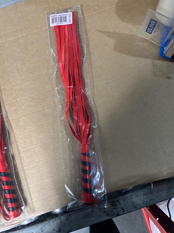 Photo 1 of Red leather whip