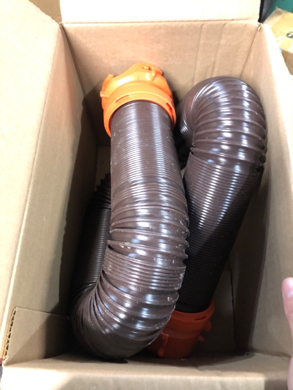 Photo 2 of Camco RhinoFLEX RV Sewer Hose Kit with Swivel Transparent Elbow and 4-in-1 Dump Station Fitting, Brown, 15 Feet (39770) 15ft Sewer Hose Kit Frustration-Free Packaging