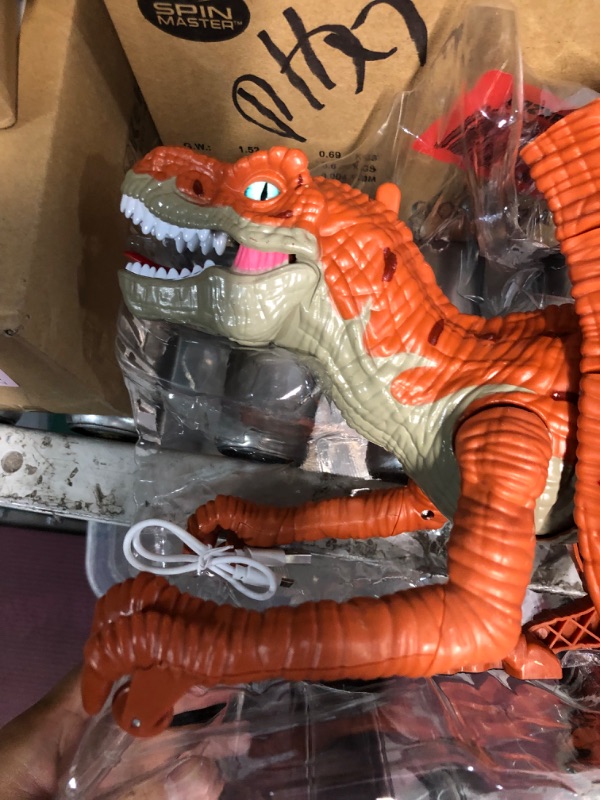 Photo 2 of **MISSING PART**
Remote Control Dinosaur Toys for Kids 3-5 Years, Realistic Electric Walking Dinosaur Figure for Boys Girls 6-12, Rechargeable RC Dinosaur Robot w/Simulation Fire Breathing, Light and Sounds Brown 666-25A  