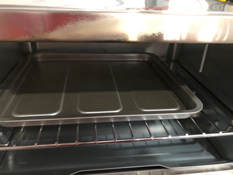 Photo 6 of ***SCRARCHED ON SIDES*SMALL DENT ON TOP*HEAT MARKS ON GLASS AND FRONT PLATR*PICTURED***
BLACK+DECKER 4-Slice Toaster Oven Stainless Steel