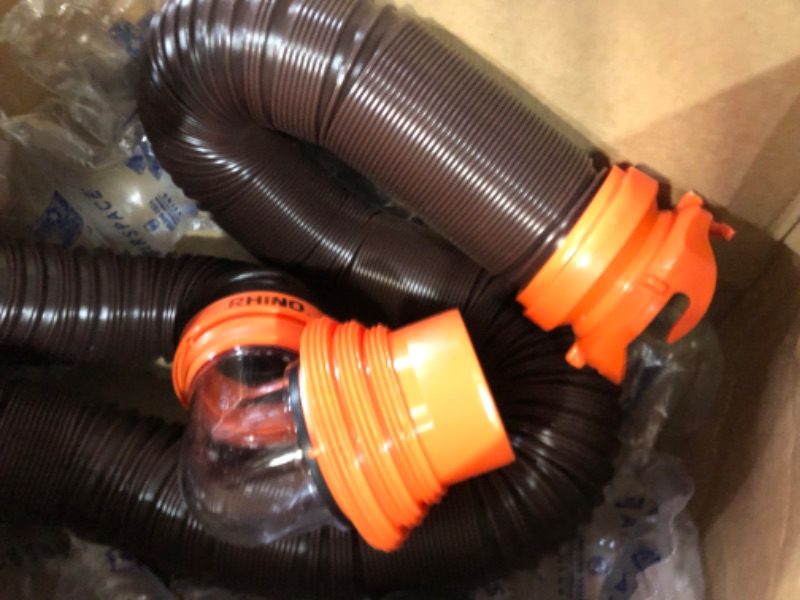 Photo 4 of Camco RhinoFLEX RV Sewer Hose Kit with Swivel Transparent Elbow and 4-in-1 Dump Station Fitting, Brown, 15 Feet (39770) 15ft Sewer Hose Kit Frustration-Free Packaging