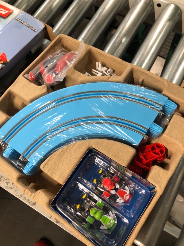 Photo 2 of Carrera First Mario Kart - Slot Car Race Track With Spinners - Includes 2 Cars: Mario and Yoshi - Battery-Powered Beginner Racing Set for Kids Ages 3 Years and Up Mario Kart w/ Spinners