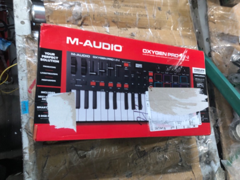 Photo 1 of M-Audio Oxygen Pro Mini – 32 Key USB MIDI Keyboard Controller With Beat Pads, MIDI assignable Knobs, Buttons & Faders and Software Suite Included 32 Mini Keys MIDI Keyboard Only