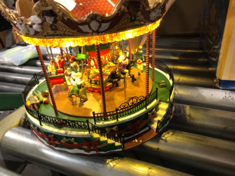 Photo 2 of **ITEM FUNCTIONS FOR A FEW SECONDS Lemax Christmas Village, Santa Carousel by Lemax