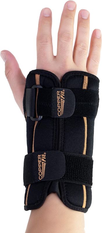 Photo 1 of Copper Fit Unisex Adult Fingerless Rapid Relief Adjustable Wrist Wrap with Ice Pack or Heat Therapy, Black, Adjustable
