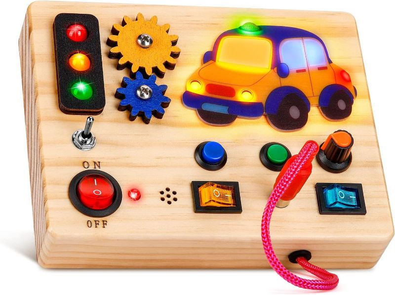 Photo 1 of Auney Montessori Busy Board with Traffic Led Lights,Wooden Sensory Toys for Toddlers 1,Baby Travel Toys with 7 Different Led Lights Sound Button,Educational Toys for 1+ Year Old Boy Car Style Gift 
