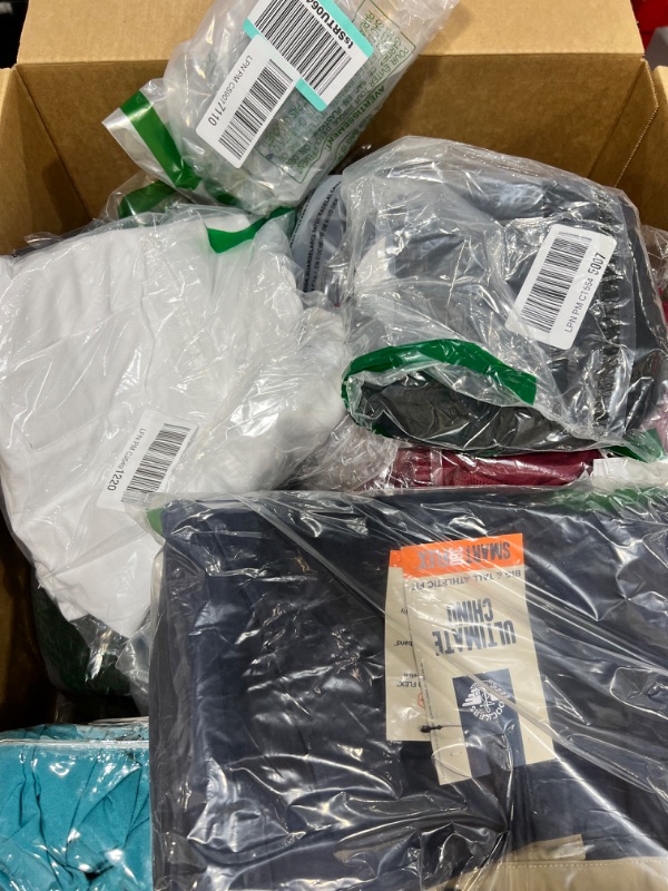 Photo 1 of Box lot of new clothes, clothes are mixed genders and sizes, some items may be damaged. sold as is
