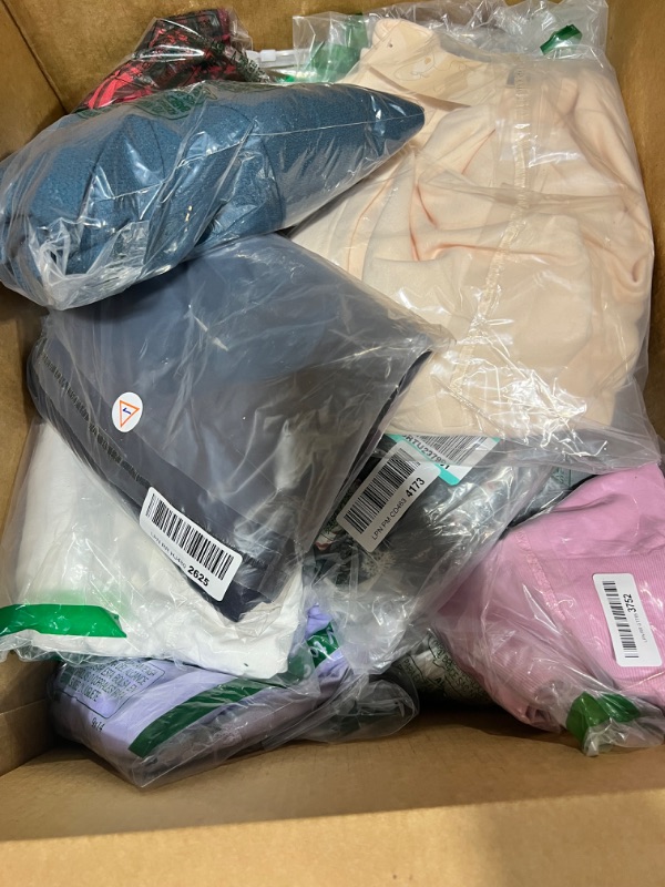 Photo 1 of Box lot of new clothes, clothes are mixed genders and sizes, some items may be damaged. sold as is
