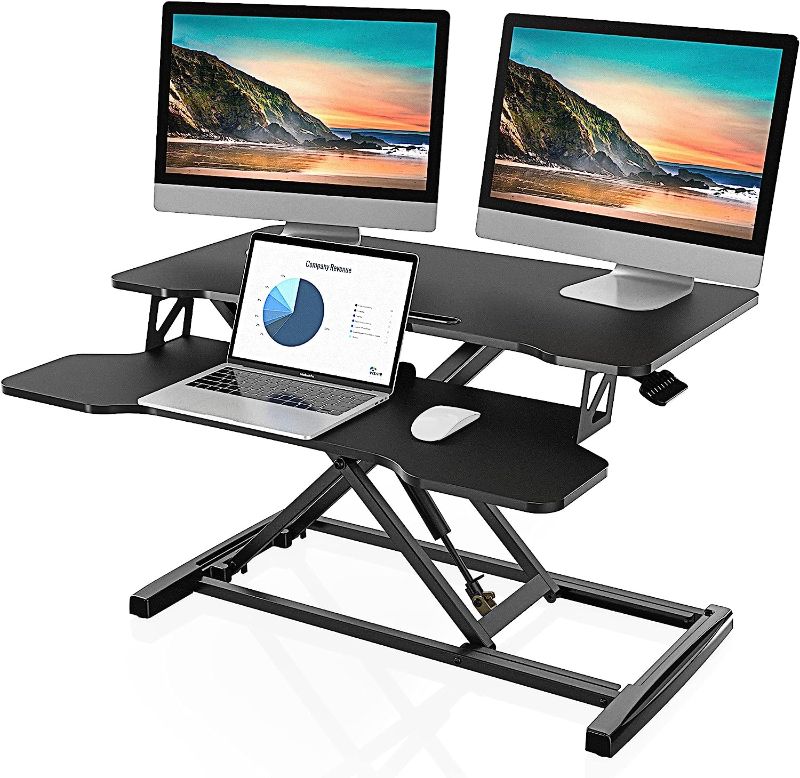 Photo 1 of FITUEYES Height Adjustable Standing Desk 32” Wide Sit to Stand Converter Stand Up Desk Tabletop Workstation for Laptops Dual Monitor Riser Black SD308001WB
