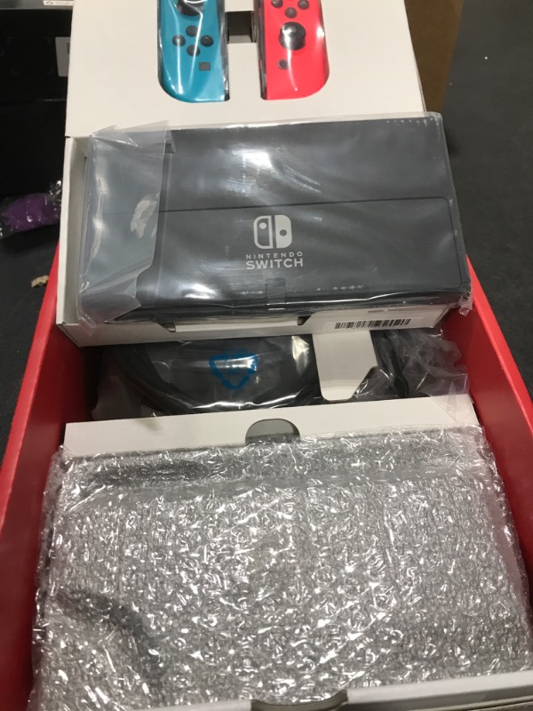 Photo 4 of Nintendo Switch – OLED Model w/ Neon Red & Neon Blue Joy-Con Neon Blue and Red Console