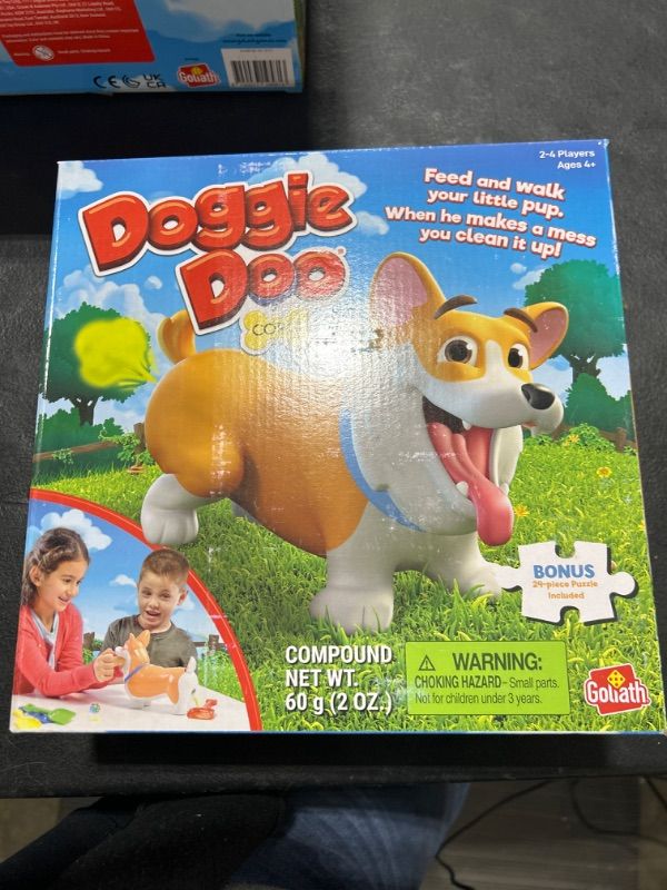 Photo 1 of Doggie Doo Corgi Game - Unpredictable Action - Feed The Doggie and Collect His Doo to Win - Includes 24-Piece Puzzle by Goliath
