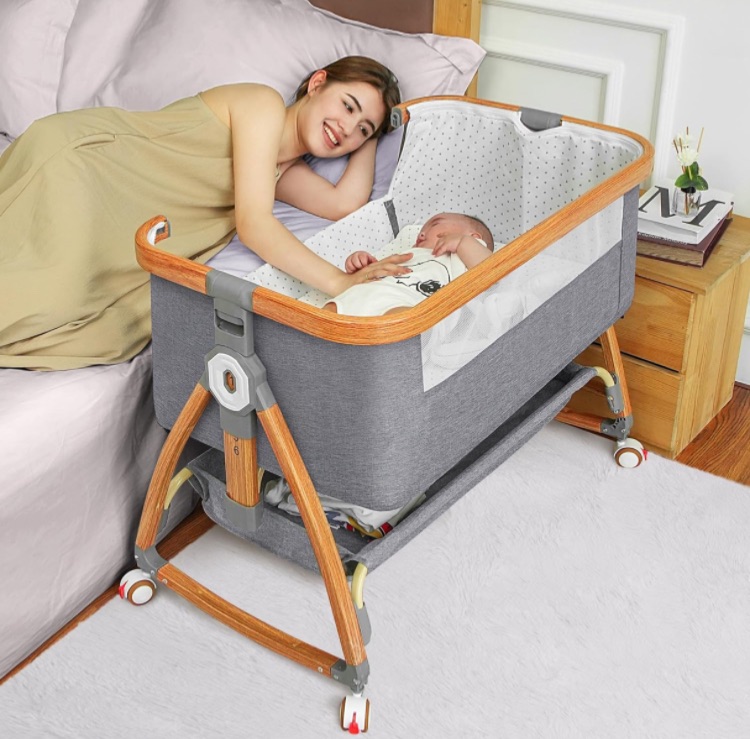 Photo 1 of Bedside Bassinet for Baby,Baby Bassinet Bedside Sleeper,Bassinet Bedside Sleeper with Wheels,Storage Basket,Mosquito Nets,Easy to Assemble Bassinet for Newborn/Infant,Adjustable Bedside Crib