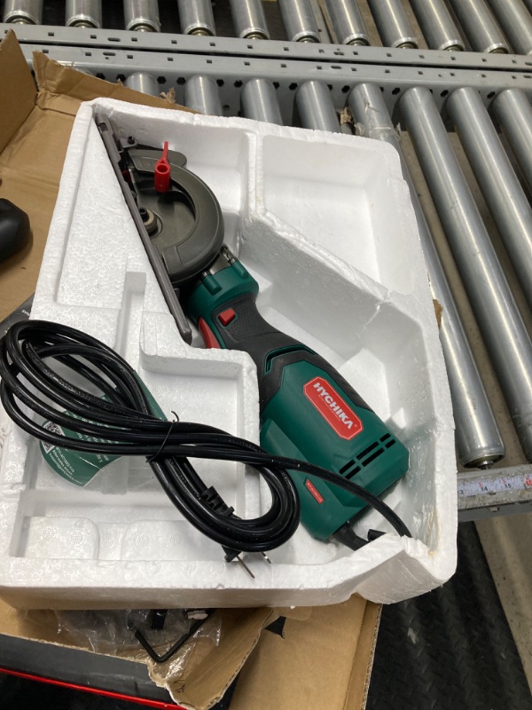 Photo 2 of ***see notes***Electric Circular Saw, HYCHIKA 6.2A Mini Circular Saw with 3 Blades(4-1/2”), Compact Hand Saw Max Cutting Depth 1-7/8'' (90°), Rubber Handle, 10 Feet Cord, Fit for Wood Soft Metal Plastic Cuts Green