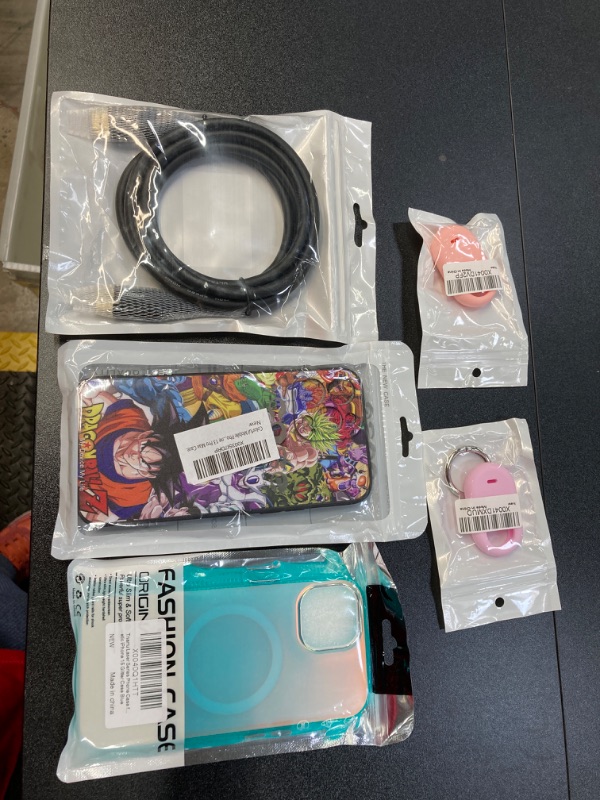 Photo 1 of MISC TECH BUNDLE///IPHONE CASES AND AIR TAG HOLDERS, AND HDMI CABLE