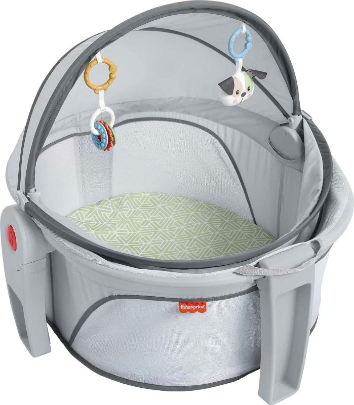 Photo 1 of Fisher-Price Portable Bassinet and Play Space On-the-Go Baby Dome with 2 Toys and Canopy, Puppy Perfection