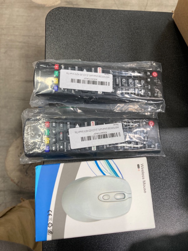 Photo 3 of tech bundle//two universal remotes and wireless mouse