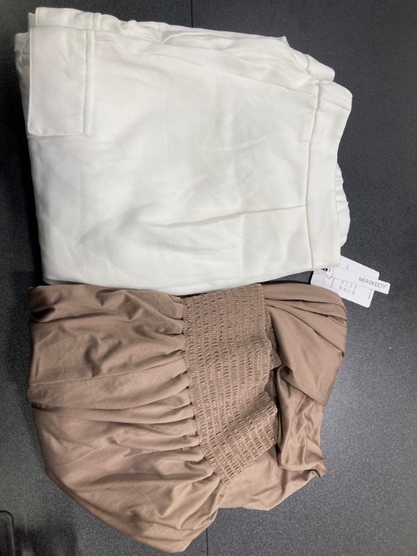 Photo 1 of WOMENS CLOTHING BUNDLE///WHITE PANTS SIZED XL AND TAUPE PANTS SIZED LARGE
