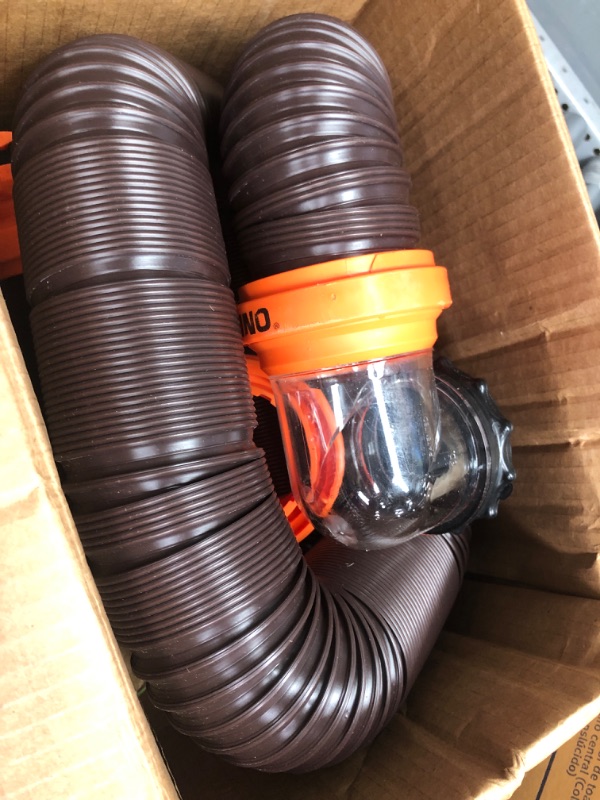 Photo 2 of Camco RhinoFLEX RV Sewer Hose Kit with Swivel Transparent Elbow and 4-in-1 Dump Station Fitting, Brown, 15 Feet (39770) 15ft Sewer Hose Kit Frustration-Free Packaging