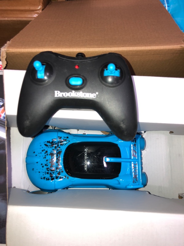 Photo 2 of Brookstone Blue Flip Spin 360 - Light-Up Performance Radio Control Vehicle, for Boys, Girls, Child ages 8+, Tweens, Teens, Adults
