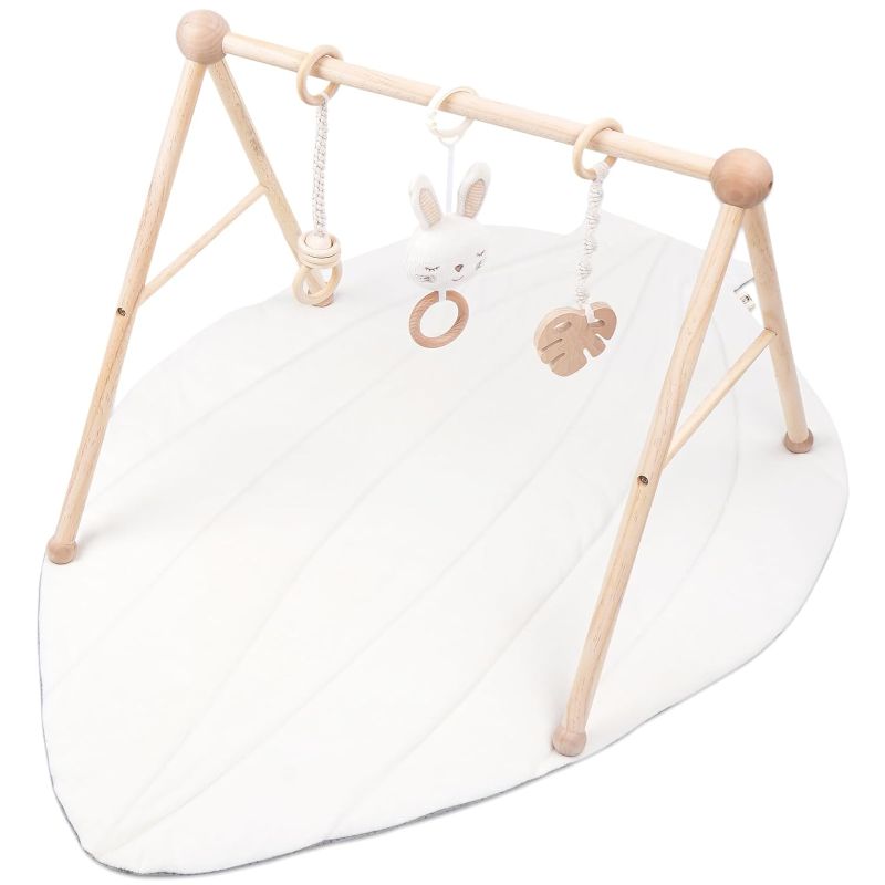 Photo 1 of COTTONBEBE Organic Baby Gym Wooden Cotton Play Mat, Super Soft Infant Activity Center for Tummy Time, Wood Baby Hanging Sensory Toys for Babies Girl Boy 0-36 Months, Newborn Gifts, White Leaf