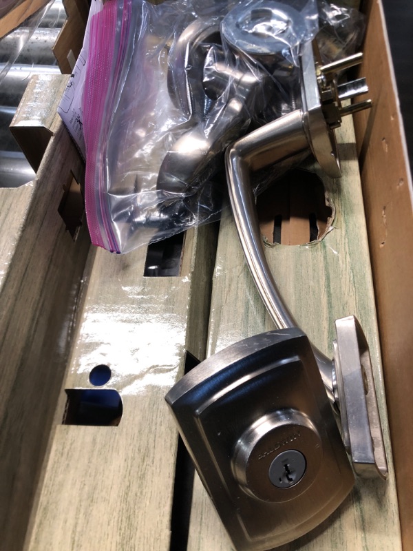 Photo 2 of ***DAMAGED - SCRATCHED AND GOUGED - LIKELY MISSING PARTS - UNABLE TO VERIFY FUNCTIONALITY***
Baldwin Nautica Single Cylinder Front Door Handleset Featuring SmartKey Security in Satin Nickel, Prestige Series with Traditional Door Hardware and Tobin Lever