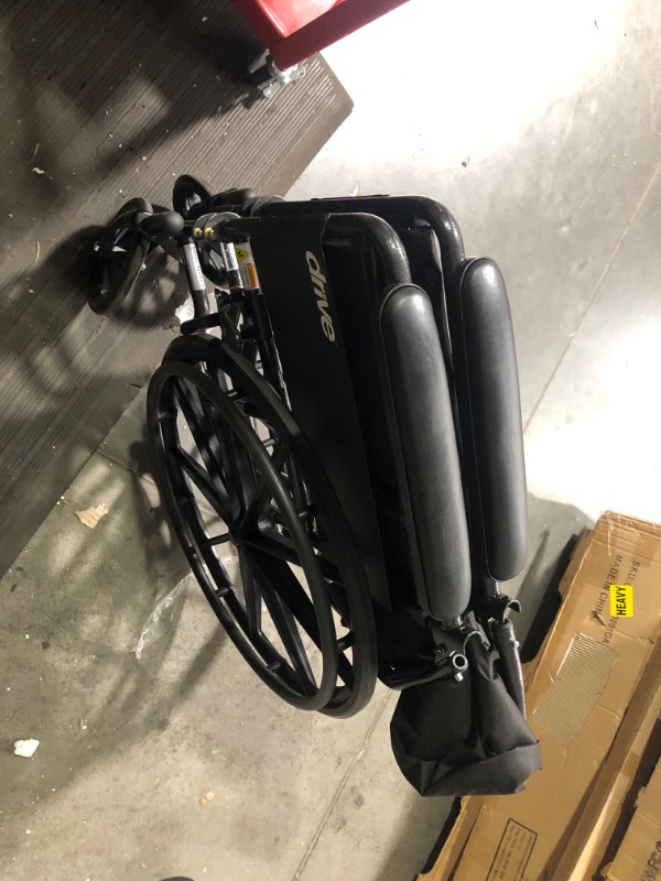 Photo 6 of ***USED - MISSING HARDWARE - SEE COMMENTS***
Drive Medical SSP118FA-SF Silver Sport 1 Folding Transport Wheelchair with Full Arms and Removable Swing-Away Footrest, Black