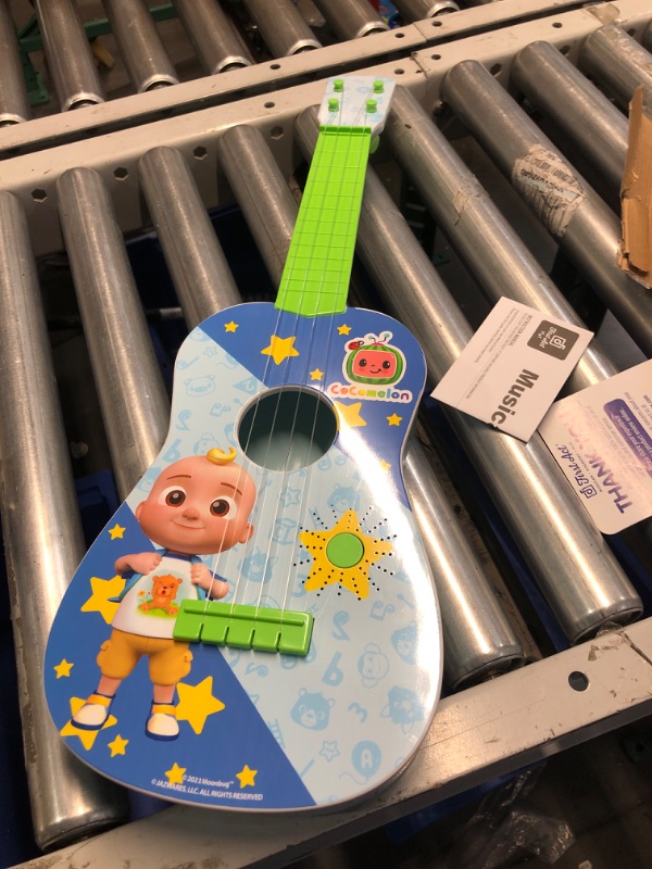 Photo 2 of CoComelon Musical Guitar by First Act, 23.5” Kids Guitar - Plays Clips of The ‘Finger Family’ Song - Musical Instruments for Kids, Toddlers, and Preschoolers