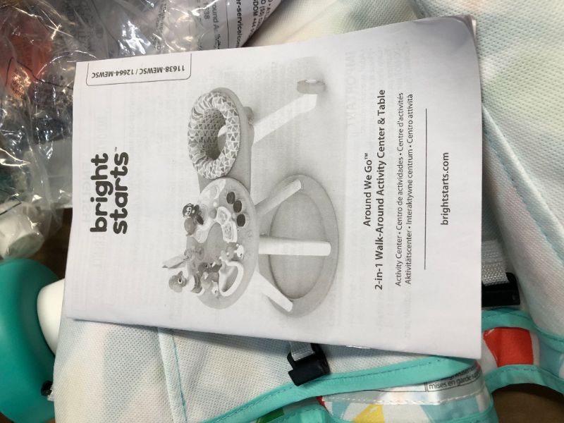 Photo 1 of ***USED - MISSING PIECE THAT CONNECTS TWO HALVES TOGETHER - OTHER PARTS LIKELY MISSING AS WELL***
Bright Starts Around We Go 2-in-1 Walk-Around Activity Center & Table, Tropic Cool
