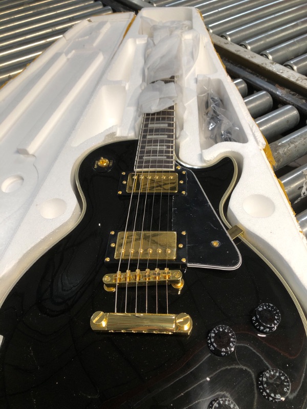 Photo 3 of ***USED - LIKELY MISSING PARTS - UNABLE TO VERIFY FUNCTIONALITY***
Hefagita Solid Electroic Guitar, Black, Gold Colored Accents, 40.5 x 14.75 x 4.5 inches