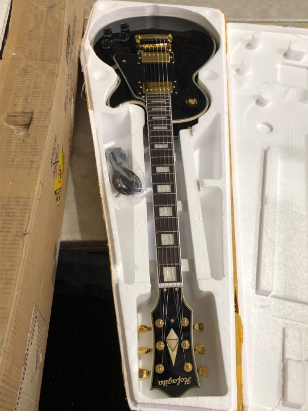 Photo 4 of ***USED - LIKELY MISSING PARTS - UNABLE TO VERIFY FUNCTIONALITY***
Hefagita Solid Electroic Guitar, Black, Gold Colored Accents, 40.5 x 14.75 x 4.5 inches