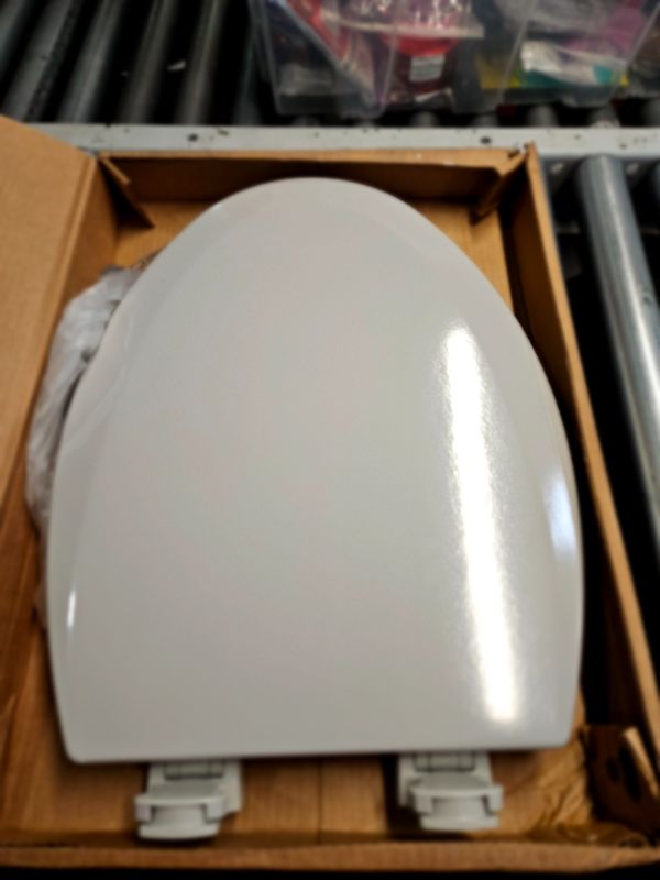 Photo 2 of **OPEN BOX - APPEARS UNUSED - DAMAGE**
Bemis 1500EC 062 Wood Elongated Toilet Seat Finish: Ice Grey