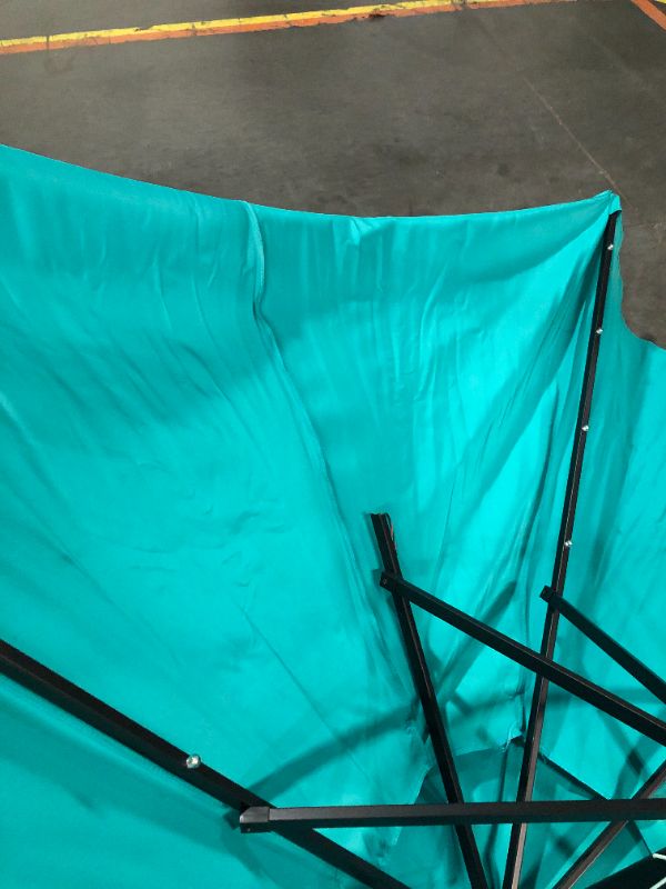 Photo 2 of ***DAMAGED - RIBS BROKEN OFF - SEE PICTURES***
Yaheetech 9FT Solar Powered Patio Umbrella - UV Protection Market Table Umbrella w/ 32 LED Lights & Push Button Tilt & Crank Lift System for Garden/Lawn/Deck/Backyard/Pool, Turquoise Turquoise 9FT