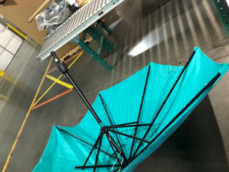 Photo 3 of ***DAMAGED - RIBS BROKEN OFF - SEE PICTURES***
Yaheetech 9FT Solar Powered Patio Umbrella - UV Protection Market Table Umbrella w/ 32 LED Lights & Push Button Tilt & Crank Lift System for Garden/Lawn/Deck/Backyard/Pool, Turquoise Turquoise 9FT