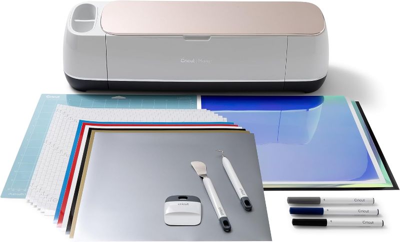 Photo 1 of Cricut Maker Bundle, Includes Cricut Maker Cutting Machine, Iron On Vinyl, Premium Vinyl - Permanent, Holographic Iron On Vinyl, Transfer Tape, Cutting Mats, Tool Set, Crafting Accessories, Champagne
