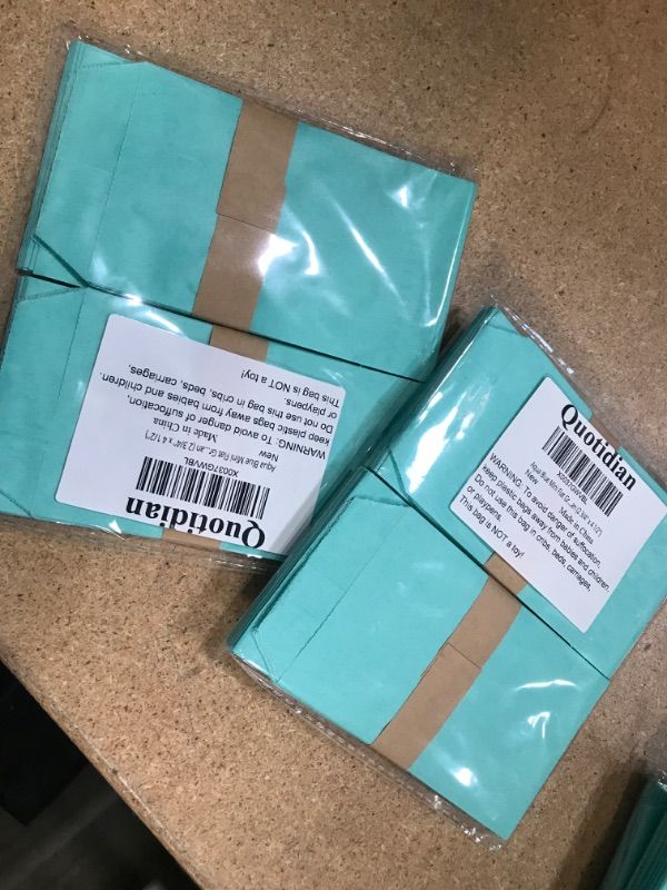 Photo 2 of 2 bags - Aqua Blue Mini Flat Greaseproof Paper Bags Envelopes for Small Treat Candy Wedding Confetti Tossing Notes Coin Stamps Seeds Soap, Pack of 100 by Quotidian (2 3/4'' x 4 1/2'') Aqua Blue 2¾x4¼ Inch (Pack of 100)