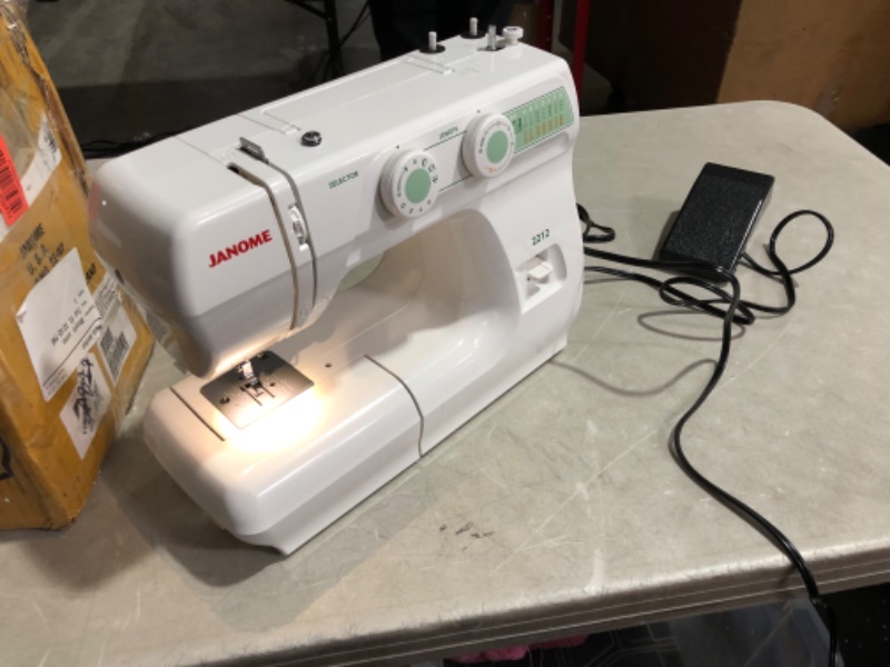 Photo 4 of ***USED AND SCRATCHED - POWERS ON - UNABLE TO TEST FURTHER - NO ACCESSORIES INCLUDED***
Janome 2212 Front-Loading Sewing Machine with 12 Built-In Stitches