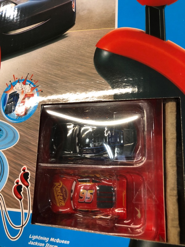 Photo 3 of Carrera First Disney/Pixar Cars - Slot Car Race Track - Includes 2 Cars: Lightning McQueen and Jackson Storm - Battery-Powered Beginner Racing Set for Kids Ages 3 Years and Up Disney Pixar Cars - Piston Cup