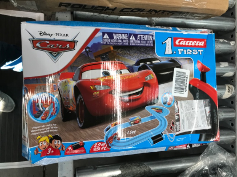 Photo 2 of Carrera First Disney/Pixar Cars - Slot Car Race Track - Includes 2 Cars: Lightning McQueen and Jackson Storm - Battery-Powered Beginner Racing Set for Kids Ages 3 Years and Up Disney Pixar Cars - Piston Cup