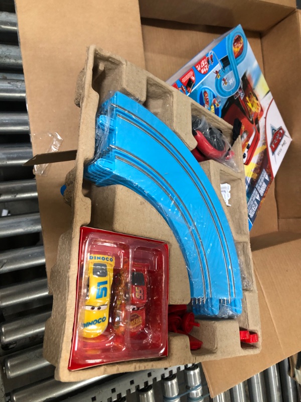 Photo 1 of Carrera First Disney/Pixar Cars - Slot Car Race Track - Includes 2 Cars: Lightning McQueen and Dinoco Cruz - Battery-Powered Beginner Racing Set for Kids Ages 3 Years and Up Disney Cars w/ Spinners
