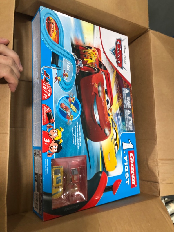 Photo 1 of Carrera First Disney/Pixar Cars - Slot Car Race Track - Includes 2 Cars: Lightning McQueen and Dinoco Cruz - Battery-Powered Beginner Racing Set for Kids Ages 3 Years and Up Disney Cars w/ Spinners