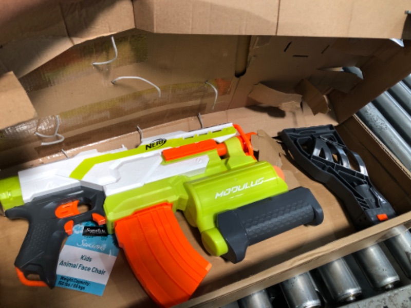 Photo 2 of ***USED - NO DARTS INCLUDED - UNABLE TO TEST***
NERF Modulus Demolisher 2-in-1 Motorized Blaster, Fires Darts and Rockets, Includes 10 Elite Darts, Banana Clip, 2 Rockets, Stock (Amazon Exclusive)