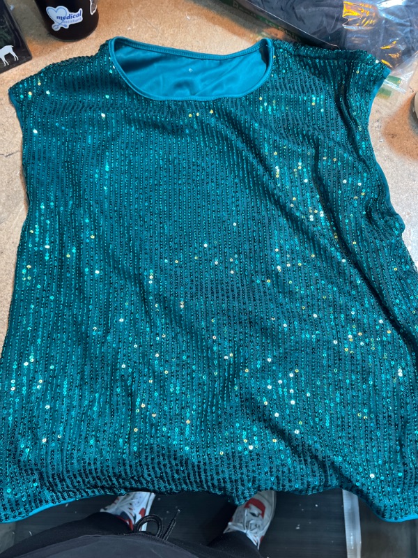 Photo 1 of  Sleeve less sparkly green shirt 