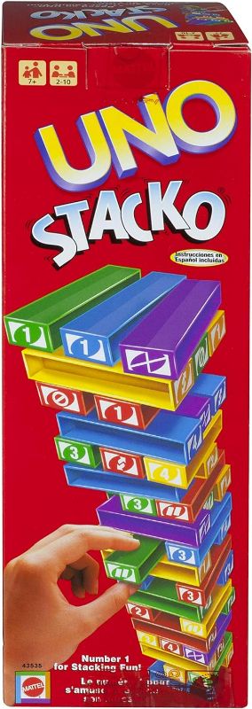 Photo 1 of Mattel Games UNO StackoGame for Kids and Family with 45 Colored Stacking Blocks, Loading Tray and Instructions, Makes a Great Gift for 7 Year Olds and Up (43535)