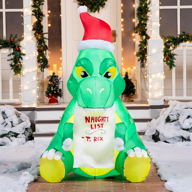 Photo 1 of Joiedomi 5 FT Dinosaur Christmas Inflatable Outdoor Decoration, Sitting Dinosaur Inflatable Build-in LEDs Blow Up Inflatables for Xmas Party Indoor, Outdoor, Yard, Garden, Lawn, Winter Décor
