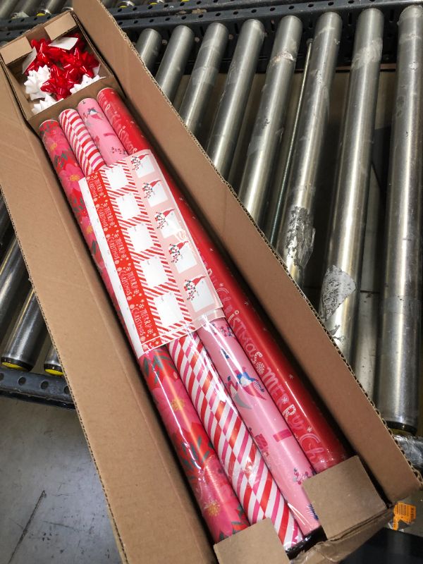 Photo 1 of American Greetings 120 sq. ft. Pink Christmas Wrapping Paper Set, Red and Pink (4 Rolls 30 in. x 12 ft., 7 Bows, 30 Gift Tags) Red, Pink